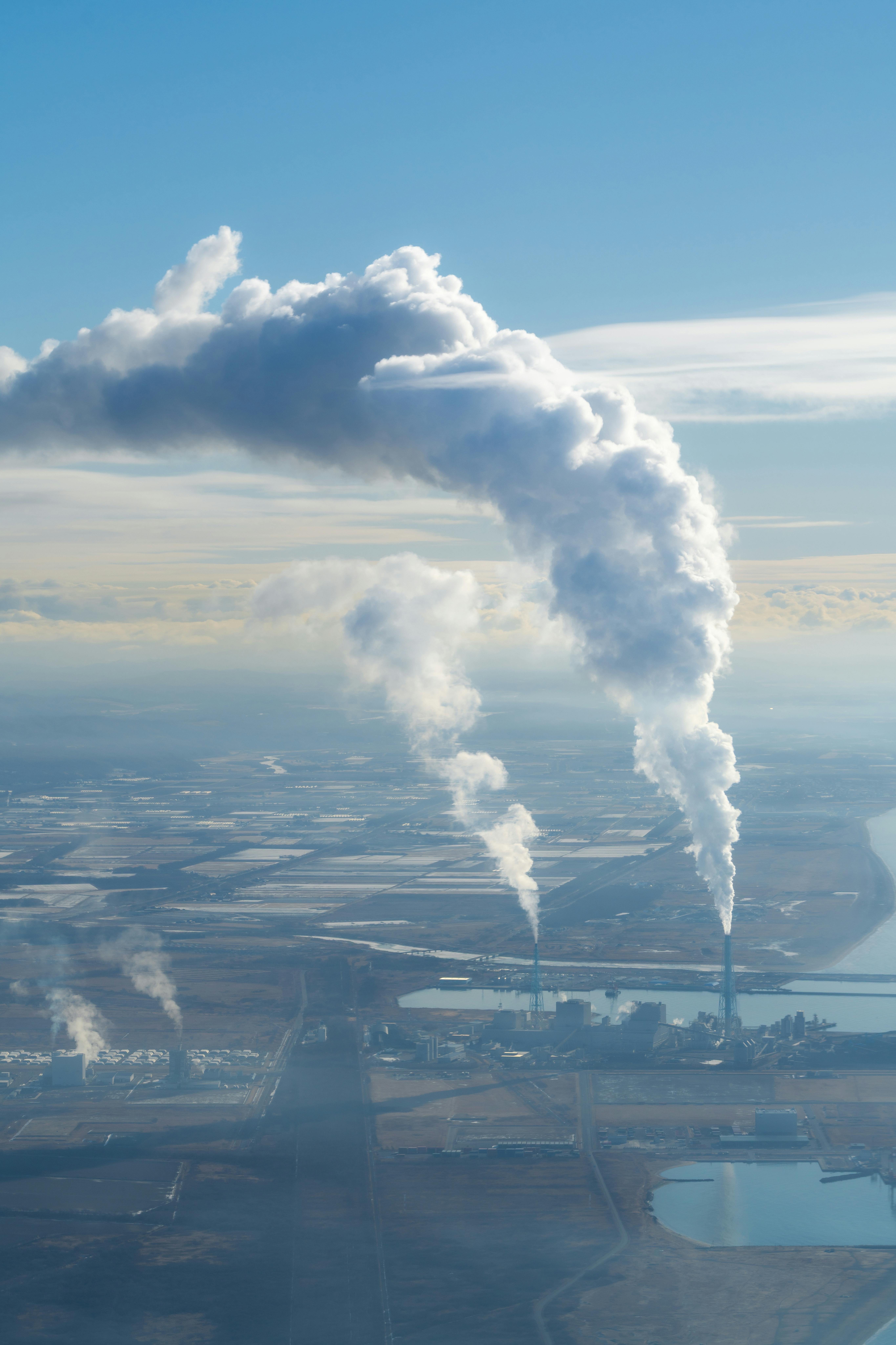 Pillars of carbon rising from a factory